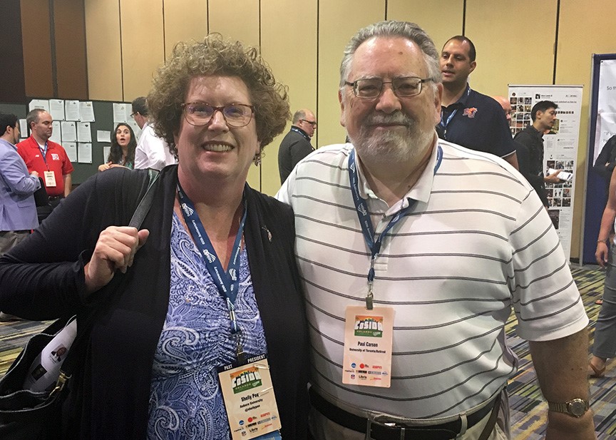 Two of the CoSIDA Mary Jo Haverbeck Trailblazer Award recipients: Shelly Poe (Auburn, 2012 recipient) and Paul Carson (University of Toronto-retired, 2017).